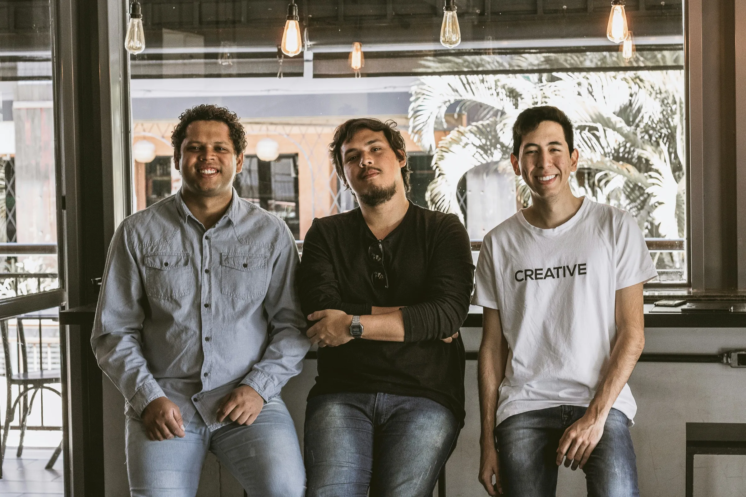 Three members of a development team standing together